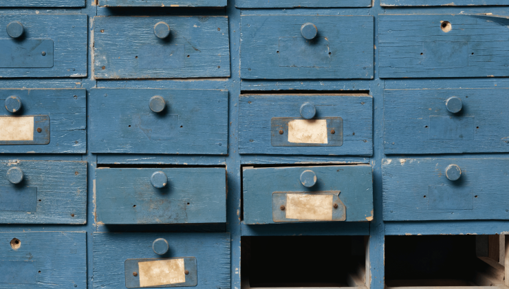 Several blue wooden drawers, some of them open